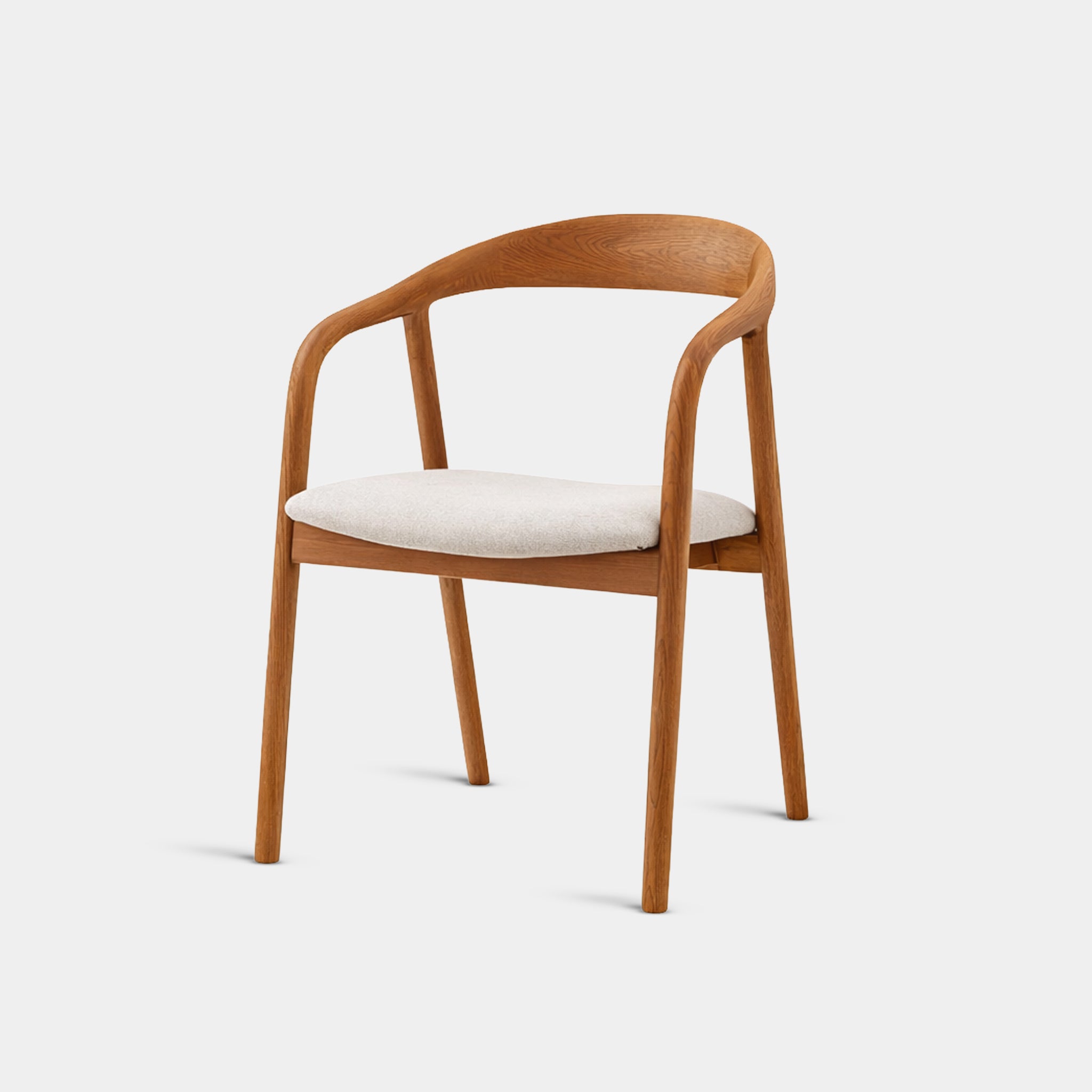 Lemongrass mid-century dining chair with broad curved teak backrest and upholstered seat, handcrafted in Chiang Mai from 100% reclaimed old teak.