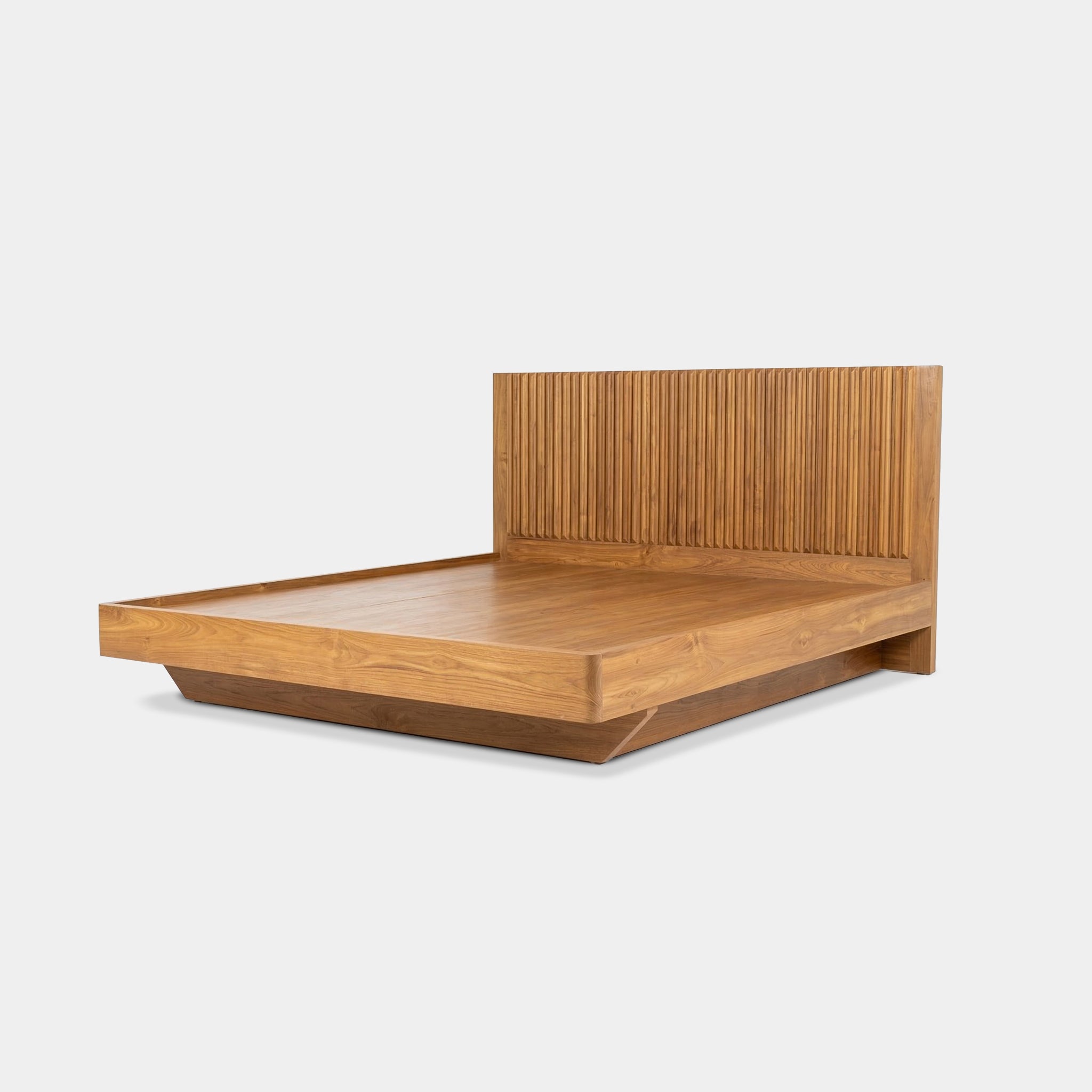 Ruen 100% reclaimed teak bed with fluted headboard and floating plinth base, handcrafted in Chiang Mai, Thailand.