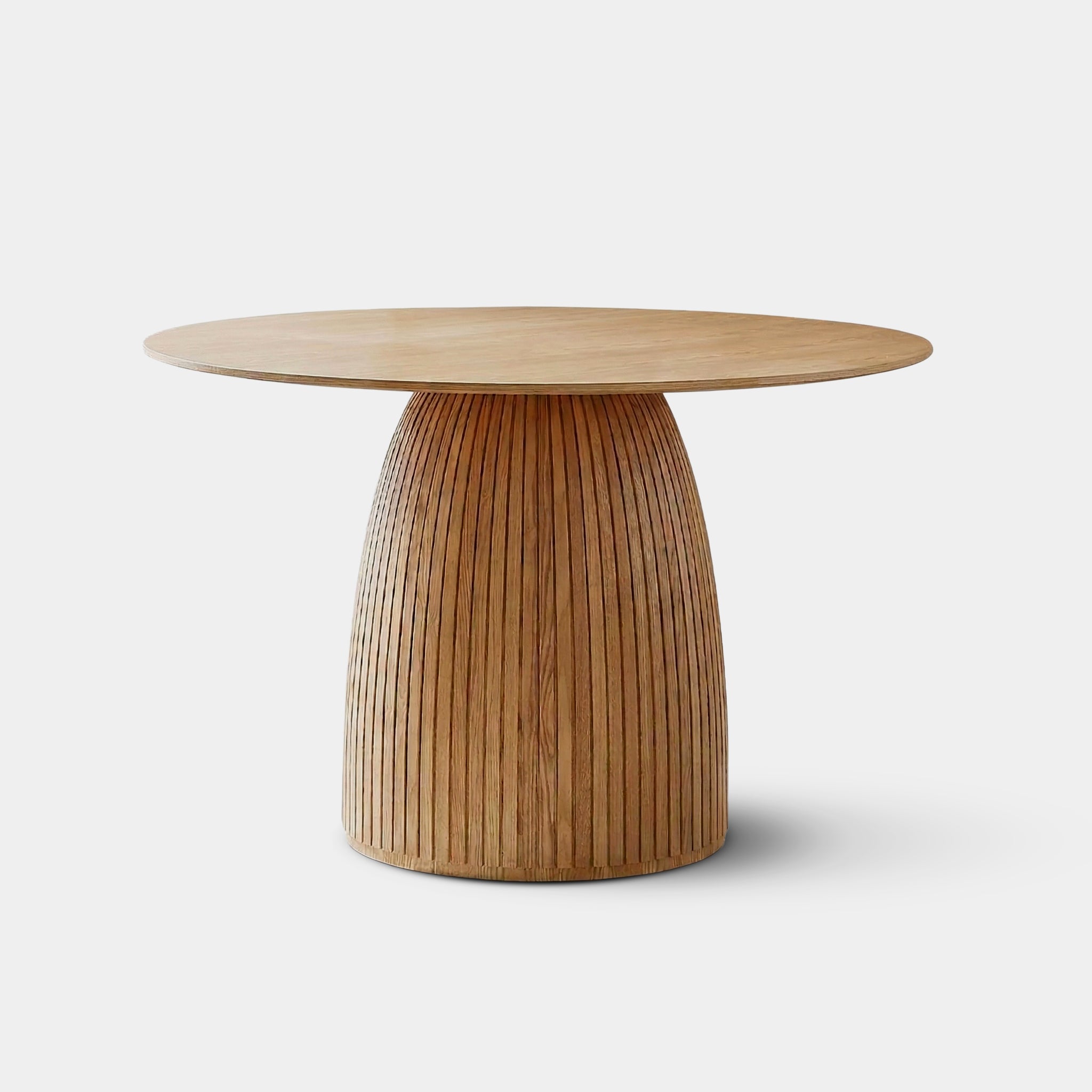 Sukhothai round dining table with sculptural triangular base, handcrafted from 100% reclaimed old teak in Chiang Mai, Thailand.